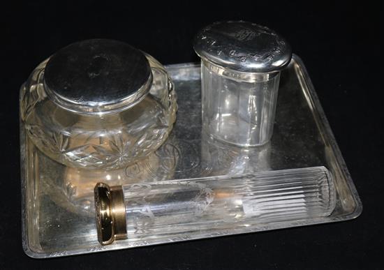 A George V silver dressing table tray by Mappin & Webb, London,m 1910 and three assorted silver topped jars.